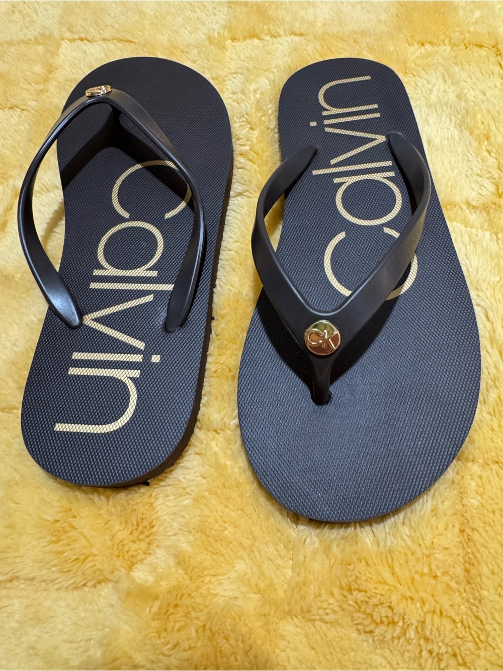 Calvin Klein Black Flip Flops with Gold Accent Logo